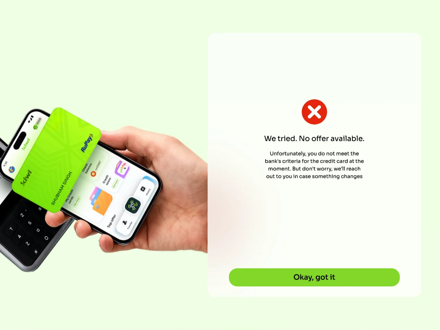 The Kiwi application’s refusal page. On the left, Kiwi’s marketing photograph of a hand holding a green Kiwi credit card over a phone; on the right, a white card carrying a red cross, the words “We tried. No offer available.” and a single green button reading “Okay, got it”.